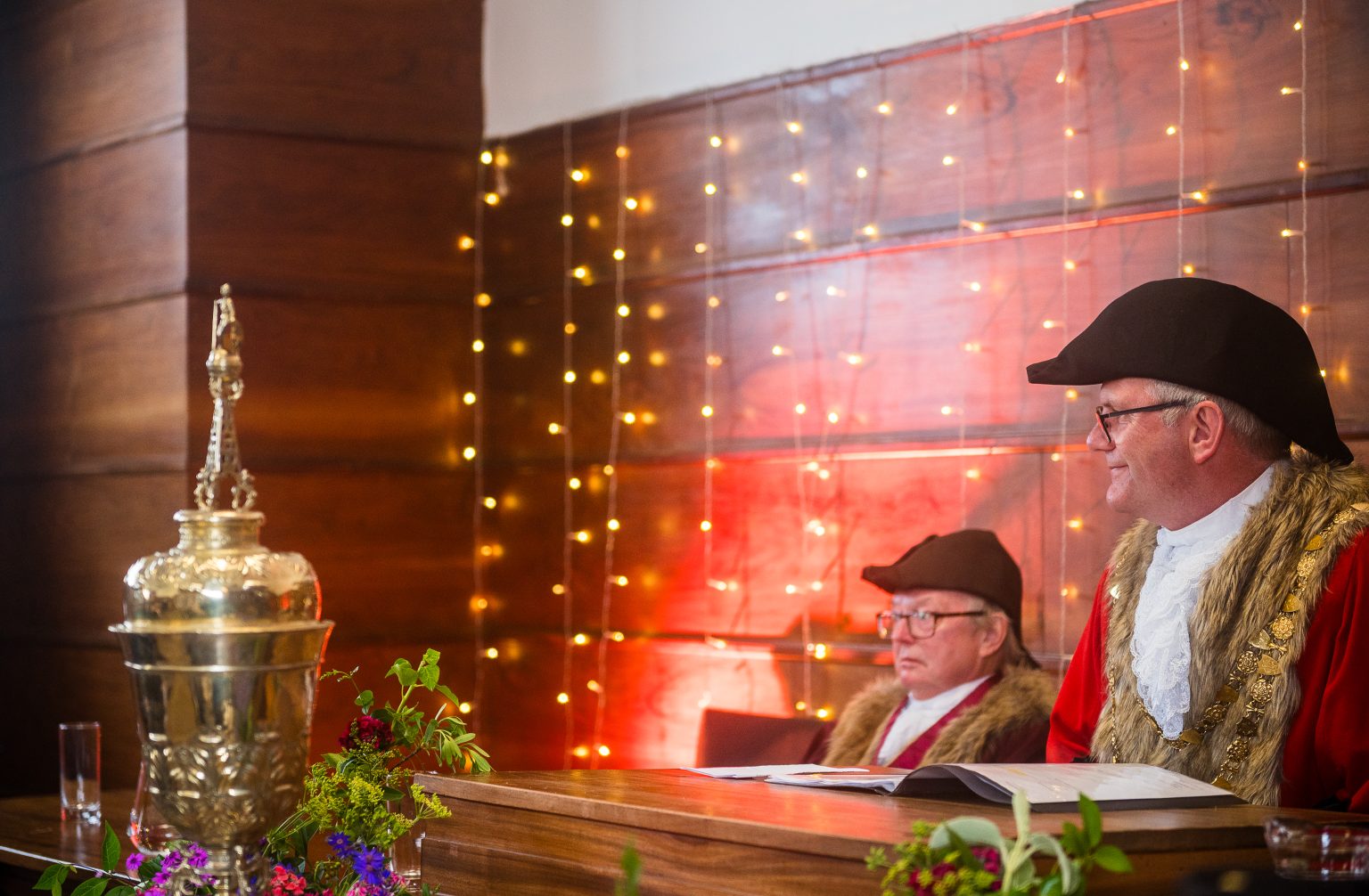two men in civic regalia and a gold cup