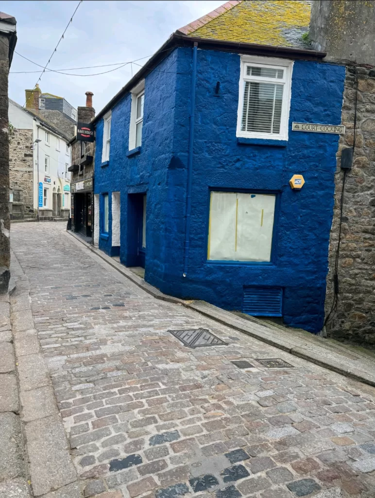 Narrow cobbled street with granite shops